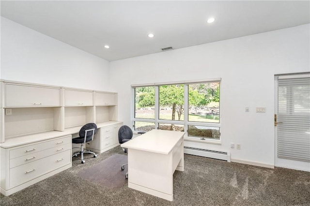 carpeted home office with a baseboard heating unit