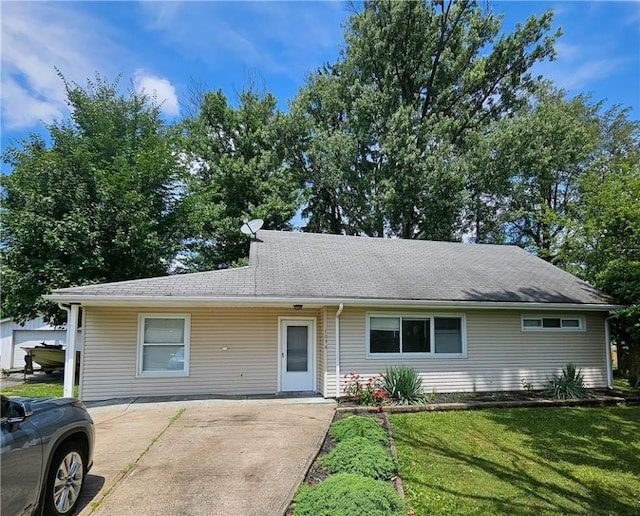 ranch-style home with a front lawn