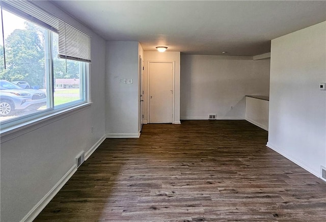 spare room featuring dark hardwood / wood-style flooring