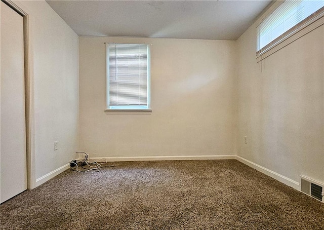 unfurnished room with carpet floors