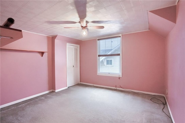 bonus room with lofted ceiling, carpet floors, and ceiling fan