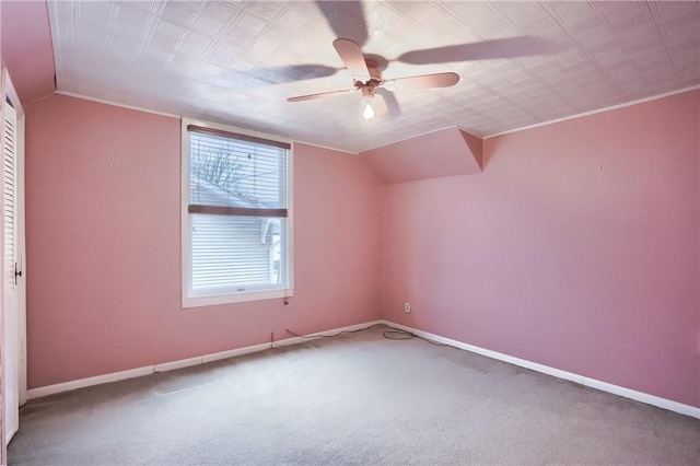 additional living space featuring lofted ceiling, carpet flooring, and ceiling fan