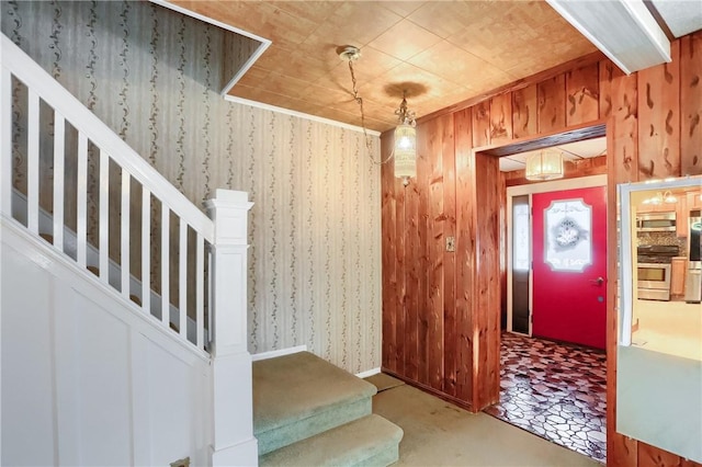 foyer entrance with wood walls