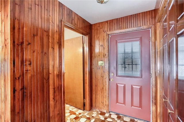 doorway with wooden walls