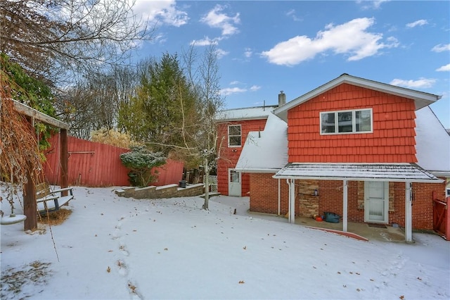 view of snow covered house