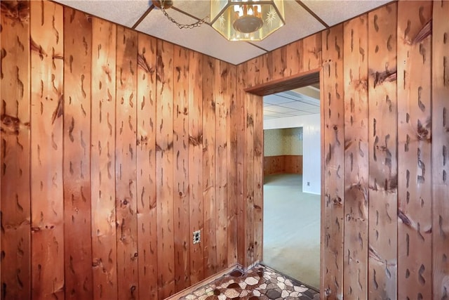 interior space featuring wooden walls