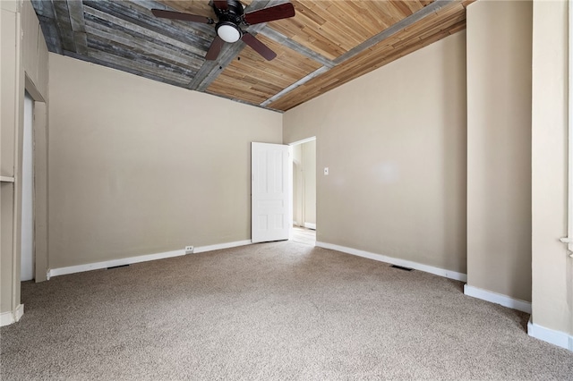 unfurnished bedroom with ceiling fan, carpet floors, and wooden ceiling