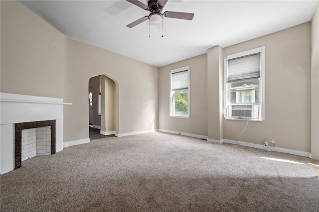 unfurnished living room with carpet, ceiling fan, and cooling unit