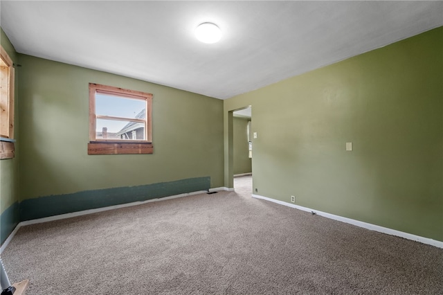 empty room featuring carpet flooring