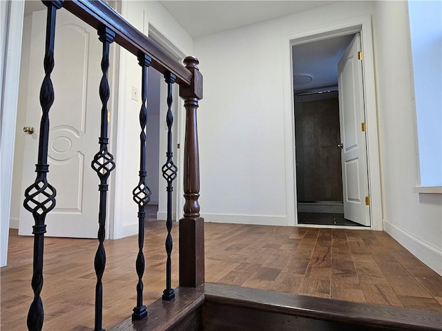 corridor featuring hardwood / wood-style floors