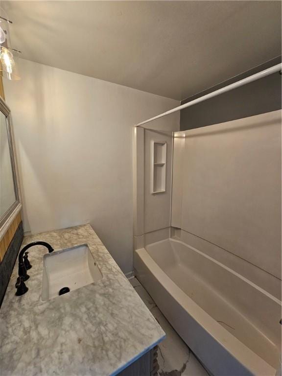 bathroom featuring vanity and tub / shower combination