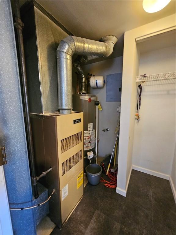 utility room with gas water heater