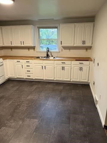 kitchen with white cabinets and sink