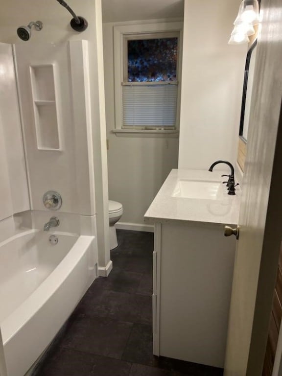 full bathroom with vanity, toilet, and  shower combination