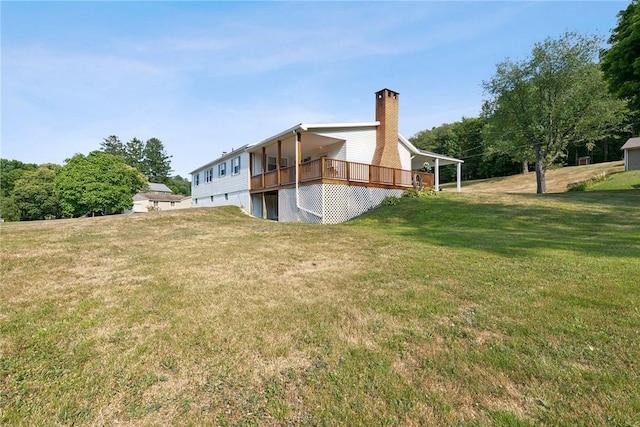 exterior space with a wooden deck and a yard