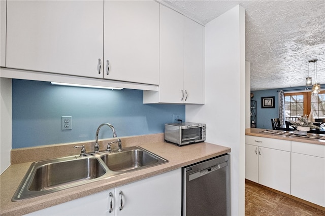 kitchen with dishwasher, sink, pendant lighting, a textured ceiling, and white cabinets