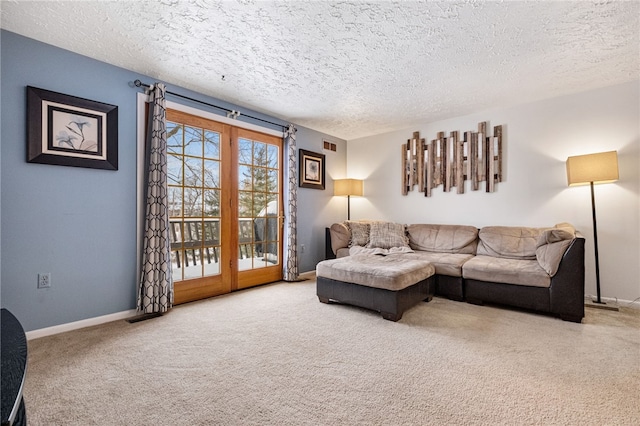 carpeted living room with a textured ceiling