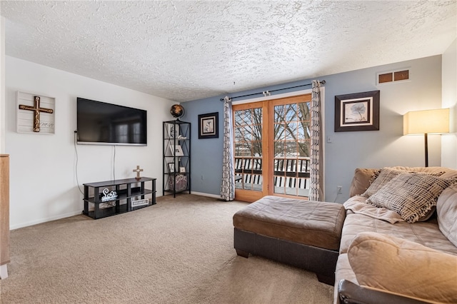 living room with carpet flooring and a textured ceiling