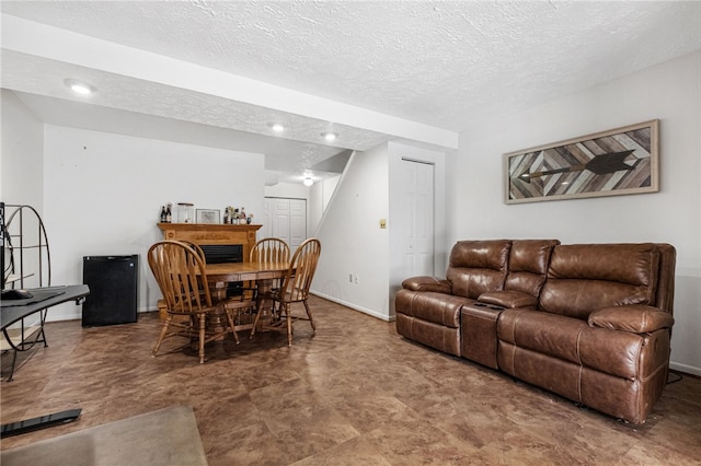 living room with a textured ceiling