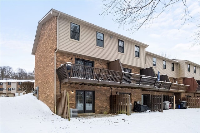 view of snow covered house