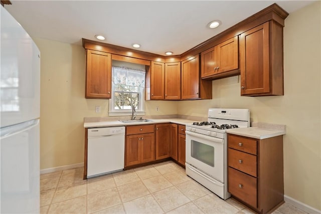 kitchen featuring sink and white appliances