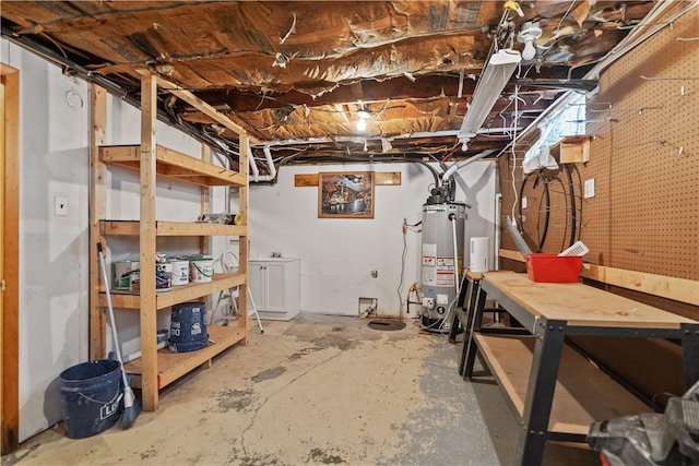 basement with a workshop area and water heater