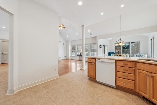 kitchen featuring lofted ceiling, hanging light fixtures, white dishwasher, ceiling fan, and decorative columns