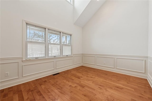 spare room featuring light hardwood / wood-style flooring