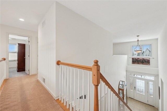 hallway with light carpet