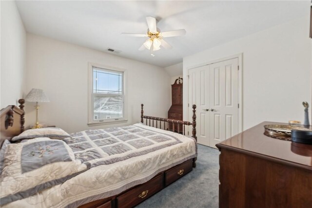 carpeted bedroom featuring ceiling fan and a closet