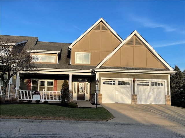 craftsman-style house featuring a porch, a garage, and a front lawn