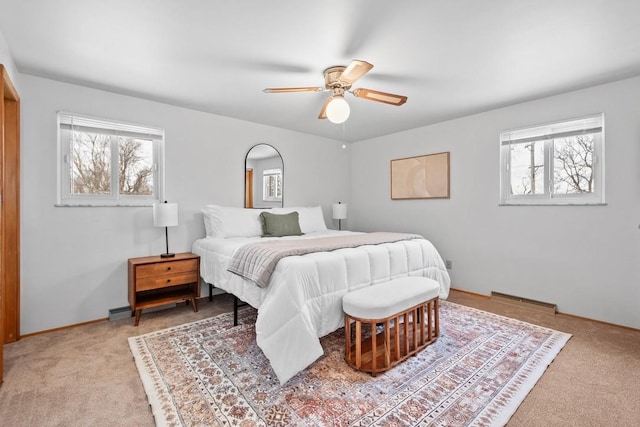 bedroom with light carpet and ceiling fan