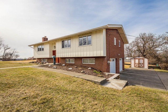 raised ranch featuring a storage shed, a front lawn, and a garage