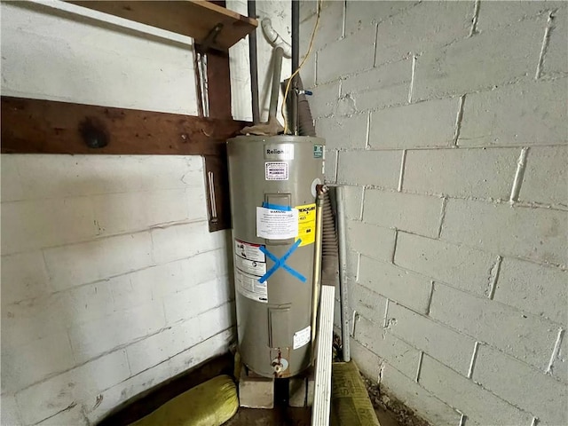 utility room featuring gas water heater