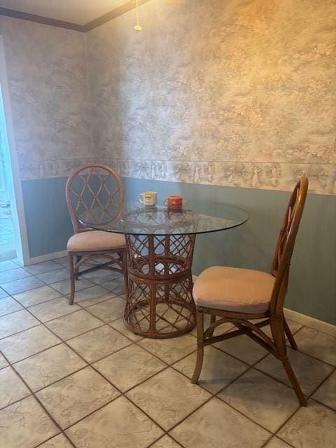 dining area featuring crown molding