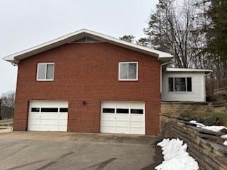 view of side of property featuring a garage