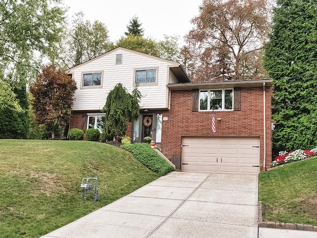 tri-level home with a front lawn and a garage