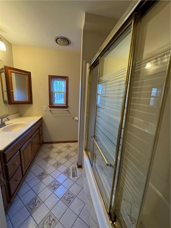 bathroom with vanity and tile patterned floors