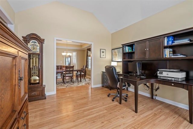 home office featuring vaulted ceiling, light wood-type flooring, and an inviting chandelier