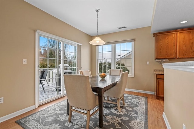 dining area with light wood-type flooring