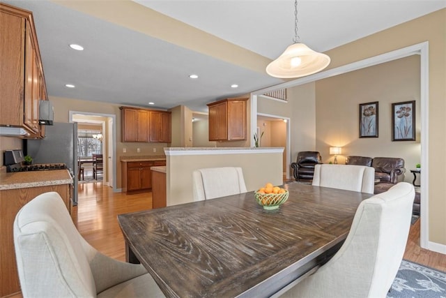 dining area featuring light wood-type flooring