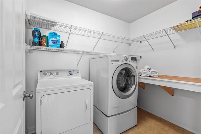 laundry room featuring separate washer and dryer