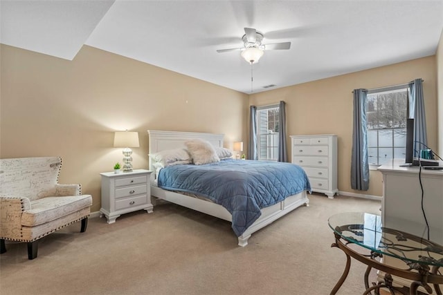 bedroom featuring light colored carpet and ceiling fan