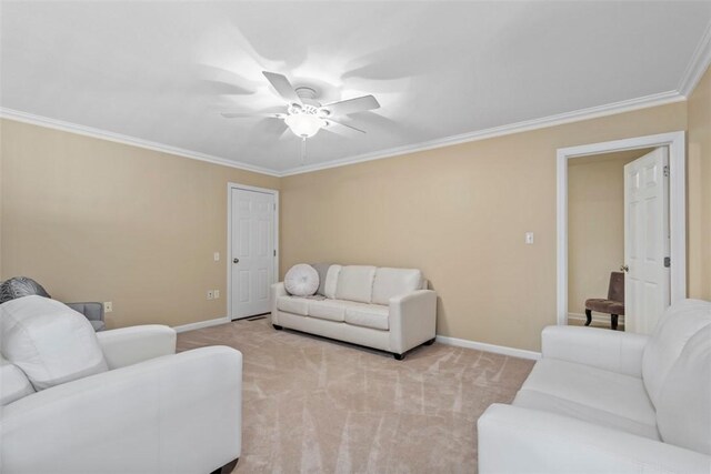 carpeted living room featuring ceiling fan and ornamental molding