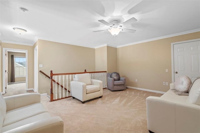 living room featuring ceiling fan, light colored carpet, and crown molding