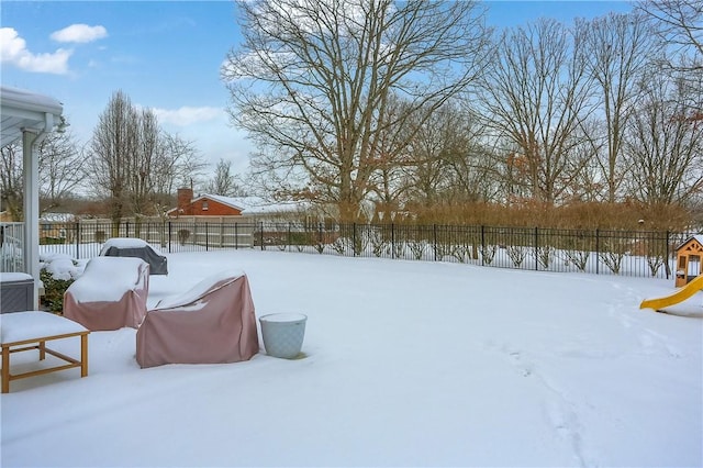 view of yard layered in snow