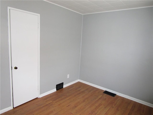 unfurnished room featuring hardwood / wood-style floors