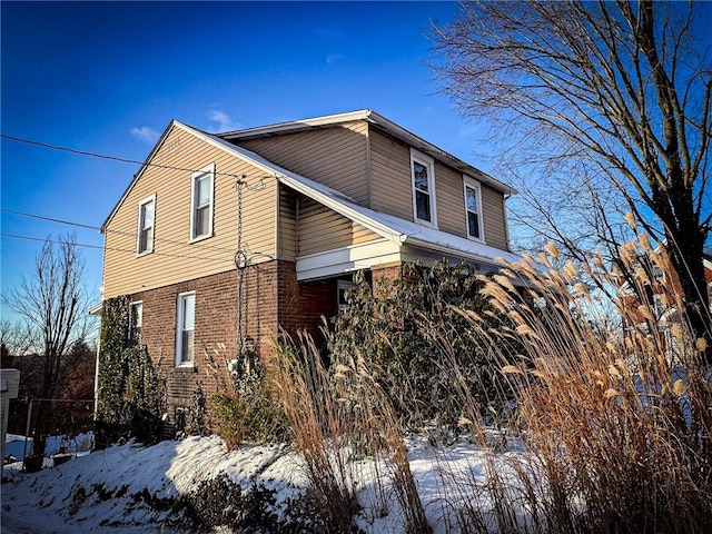 view of snow covered property