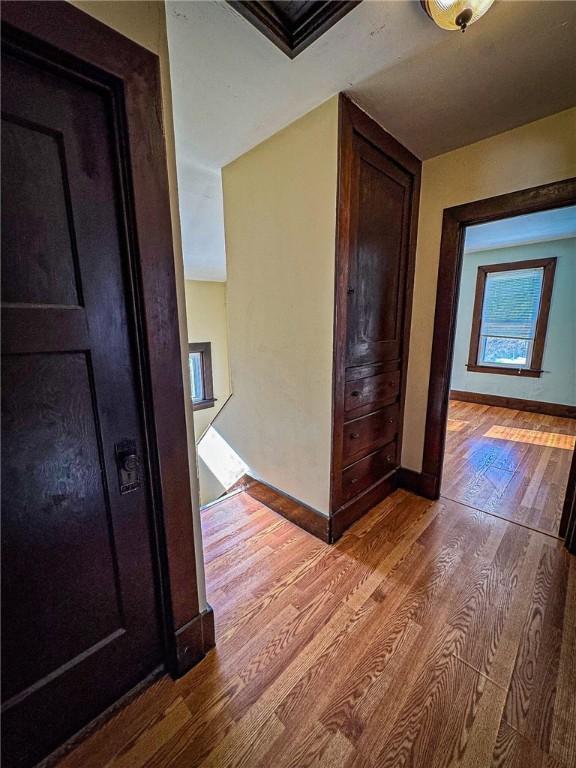 corridor featuring light hardwood / wood-style floors