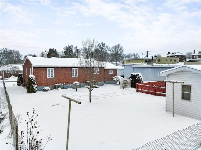 view of snow covered house